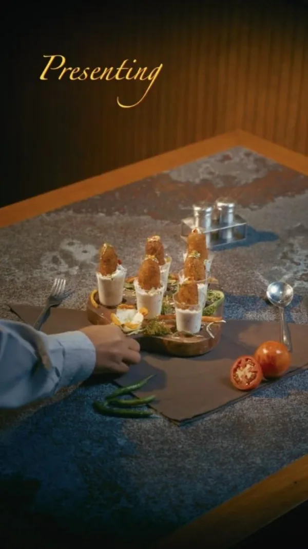 Dish reel: crispy baby corn cigars served in shot glasses.