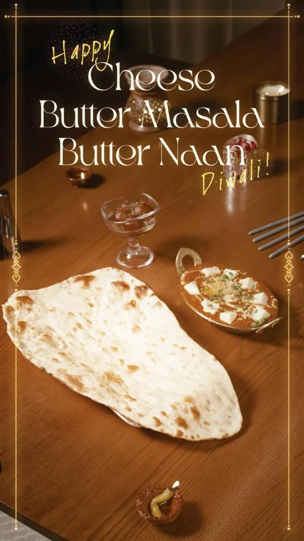 Diwali table: Cheese Butter Masala and butter naan in the glow of diyas.